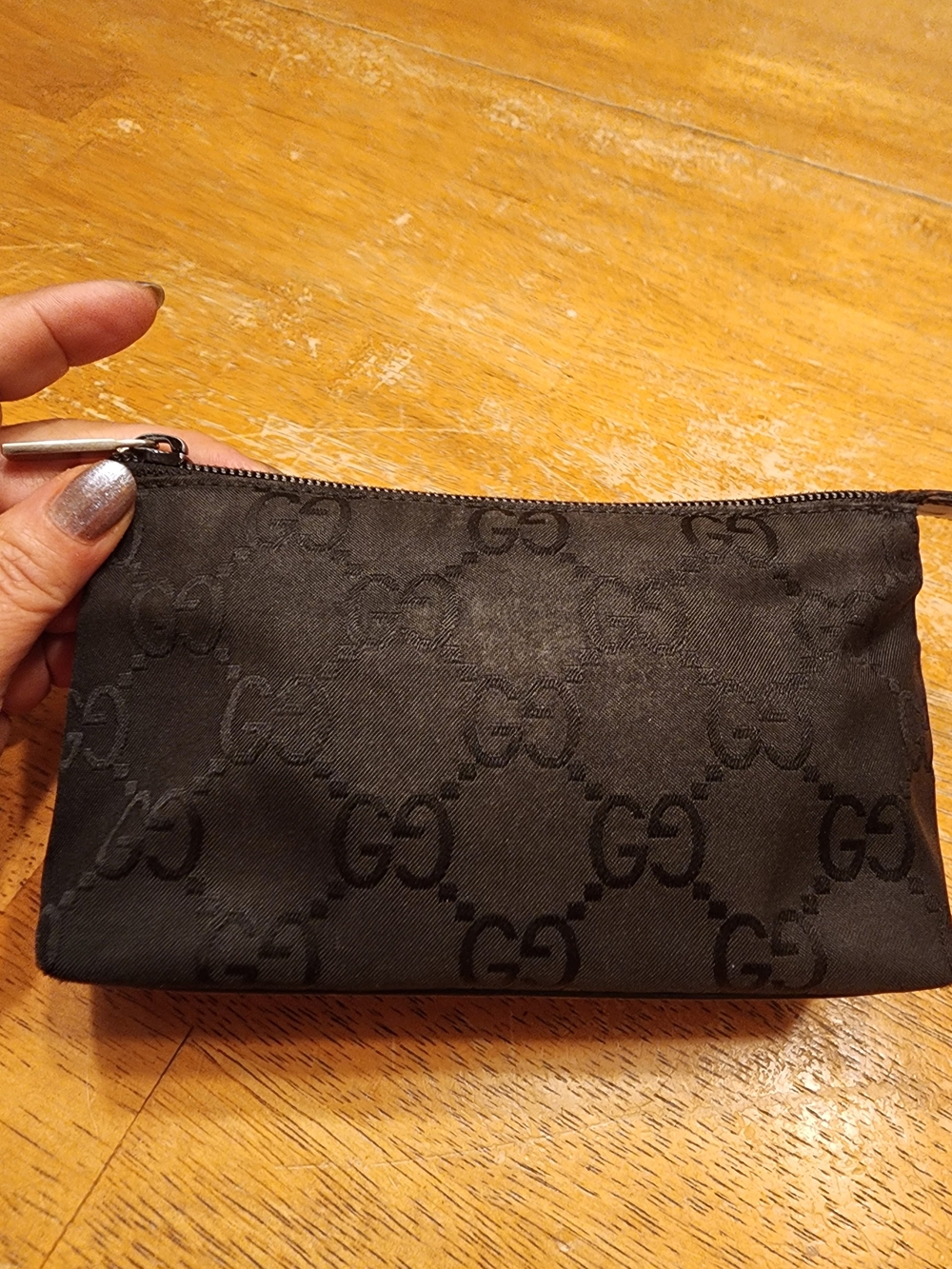 vintage Gucci black GG monogram canvas cosmetic pouch featuring a tonal pattern